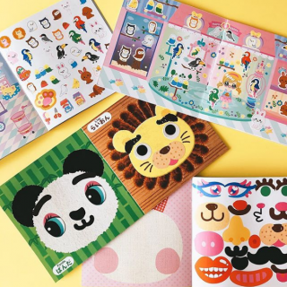 ぺたぺたぺたっ。どんなお顔ができるかな？　“１００円で暮らしは楽しくなる。“